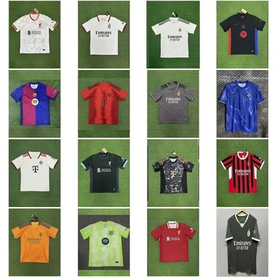 Sixteen football shirts in club colours arranged in a four by four grid on green turf