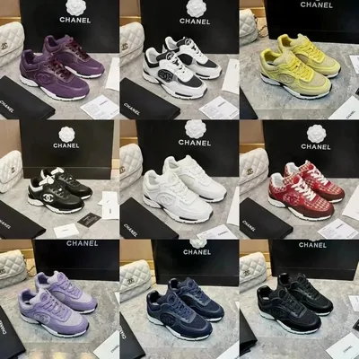 Twelve low-top trainers in purple, white, black, yellow and red, each photographed beside the branded box it came in