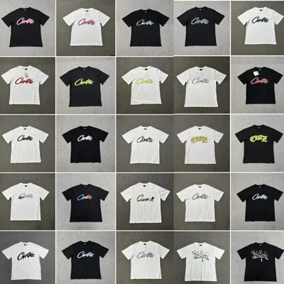 Twenty-five printed T-shirts laid out in a five by five grid on grey, roughly half black and half white, all carrying the same script logo